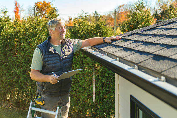 Professional Roofing technician working in Freedom, PA